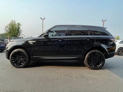 2016 Land Rover Range Rover Sport HSE td6 in black with brown interior, showcasing luxury and rugged capability.