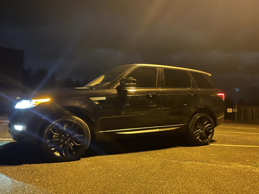 2016 Land Rover Range Rover Sport HSE td6 in black with brown interior, showcasing luxury and rugged capability.